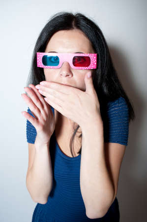 young woman gets scared while watching a 3D movie