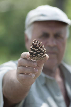 portrait of the man with the pine cone
