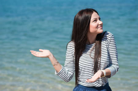 young woman enjoying the beach on a sunny summer day