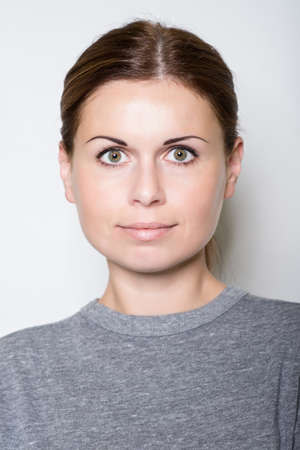 beautiful young woman  looks in the camera