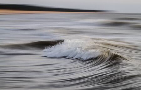 Long exposure shot of sea waves, using wave panning techniqueの写真素材