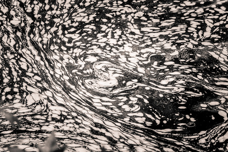 An abstract, monochrome pattern of river surface. Van Gogh style.の写真素材