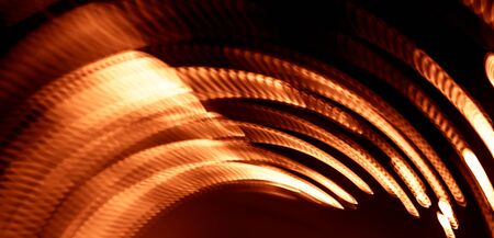 Colorful abstract trails of light. Dots, lines and bokeh on dark background. Long exposure.