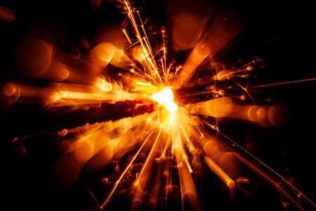 Beautiful red sparkler candle. Abstract close-up look.の写真素材
