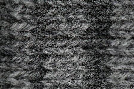 A beautiful closeup of a hand knitted warm and soft wool pattern. Soft socks or scarf of natural wool. Colorful pattern.の写真素材