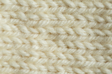 A beautiful closeup of a hand knitted warm and soft wool pattern. Soft socks or scarf of natural wool. Colorful pattern.の写真素材