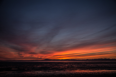 A beautiful colorful sunset view on the Morecambe beachの写真素材