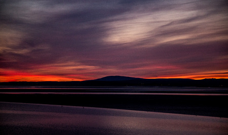 A beautiful colorful sunset view on the Morecambe beachの写真素材