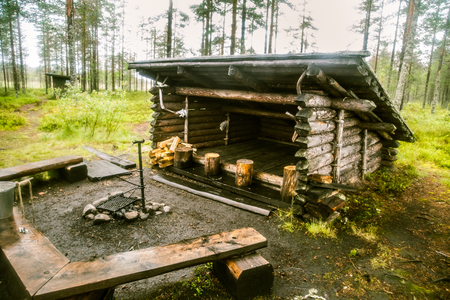 A beautiful small wooden building in the middle of Finnish forestの写真素材