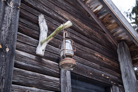 An old wooden building in a winter landscapeの写真素材