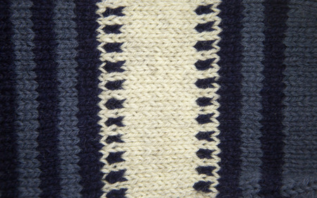 Colorful pattern ow a hand made wool socks. Natural clothing. Bright colors, close up pattern.
