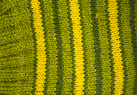 Colorful pattern ow a hand made wool socks. Natural clothing. Bright colors, close up pattern.