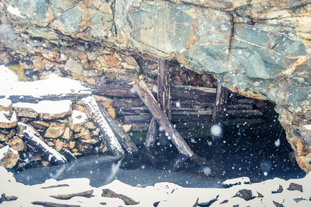 A snowy landscape with an old copper mine in central Norway. Cristianus Sextus mine area in first snow. Historic landscape.の写真素材