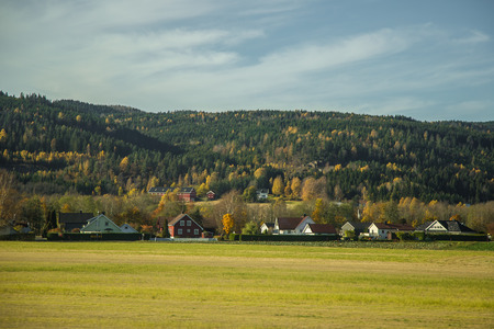 Beautiful autumn landscape in Norway with yellow leaves. Colorful nordic scenery.の写真素材