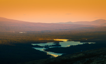 A beautiful, colorful sunset in mountains. Beautiful autumn in Norway. Abstract colorful look.の写真素材