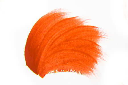 An abstract paint dab in red color on white background. Graphic element.の写真素材