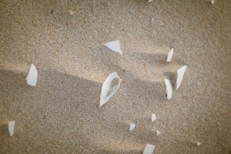 A beautiful pattern of white sand on a beach of Baltic Sea. Closeup look, natural background.