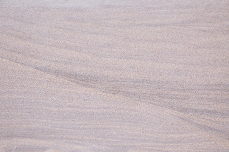 A beautiful pattern of white sand on a beach of Baltic Sea. Closeup look, natural background.の写真素材