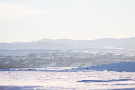 Beautiful minimalist landscape of winter in central Norway. Clear scenery in sunny day.の写真素材