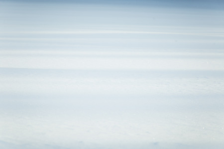 Beautiful fresh snow pattern in minimalistic style. Winter background. Norway, Northern Europe. Close up textureの写真素材