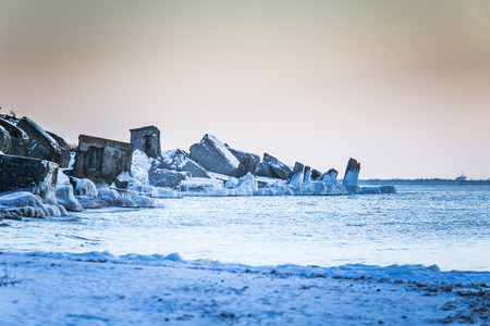 A beautiful frozen salt water on the beach of Baltic sea. Ice formations in winter. Landscape with sea and ice.の写真素材