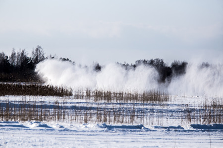 Cars racing on the frozen lake. Drifting cars on ice. Fun sport in winter.の写真素材