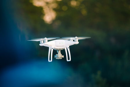 A beautiful flying drone in the evening skies.の写真素材