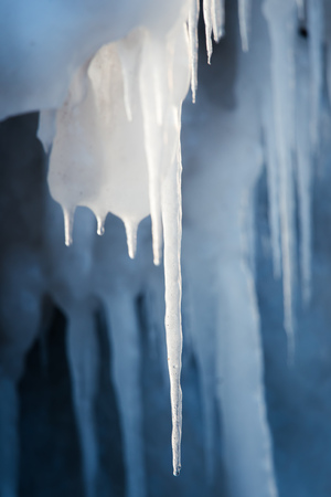 A beautiful hangign icicles of salt water on the coast of Baltic sea. Ice in the beach at winter....