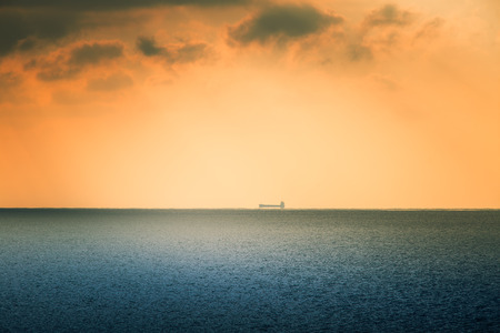 A beautiful landscape of a sea in winter evening. Baltic sea at the sunset. Vivid colors.の写真素材