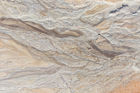 Beautiful sand patterns on the shore of baltic sea. Abstract, colorful background of sand on the...