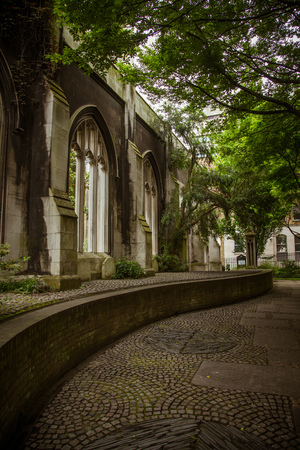 A beautiful old church transformed into public park in London. Landscape with a historic architecture.の写真素材