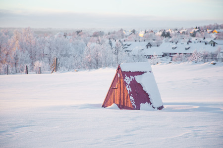 A beautiful evening scenery of a small Norwegian town Roros in winter. Sunset scenery in Norway. Scandinavian town landscape.の写真素材