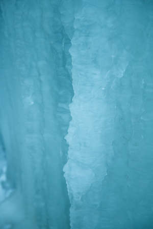 Beautiful frozen icicles on the roadside. Norwegian winter scenery. Beautiful ice structures.