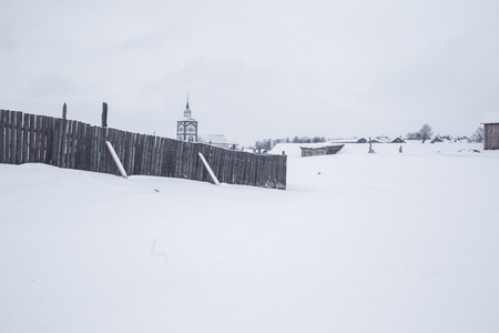 A winter scenery in a small Norwegian town Roros. Overcast day with snow. Scandinavian landscape.の写真素材