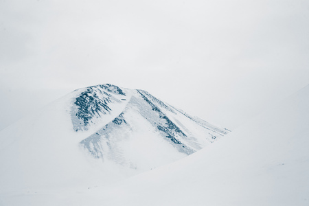 A winter scenery in a small Norwegian town Roros. Overcast day with snow. Scandinavian landscape.の写真素材
