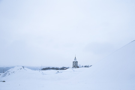 A winter scenery in a small Norwegian town Roros. Overcast day with snow. Scandinavian landscape.の写真素材
