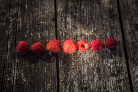 Beautiful, freshly picked garden raspberries in the summer. Summer berries, natural food, healthy dessert.の写真素材