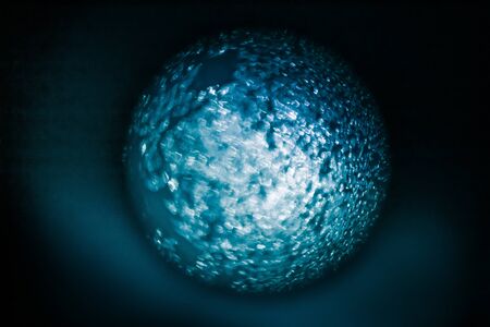 A beautiful, abstract blue orb of blurred pattern. Planet looking texture.の写真素材