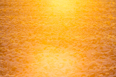 A morning landscape of snow covered grain fields in the Northern Europe. First snow on the agricultural field. Bright morning scenery during the sunrise.の写真素材