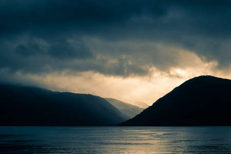 A beautiful view of the Norway fjord from the sea level. Autumn landscape of fjords in Northern...