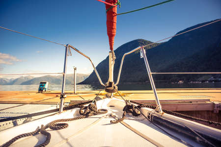 A view from a sailing boat cruising the Norway fjords. Sailing vessel in the fjord.