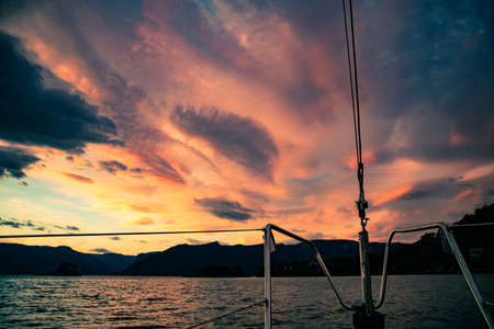 A view from a sailing boat cruising the Norway fjords. Sailing vessel in the fjord.