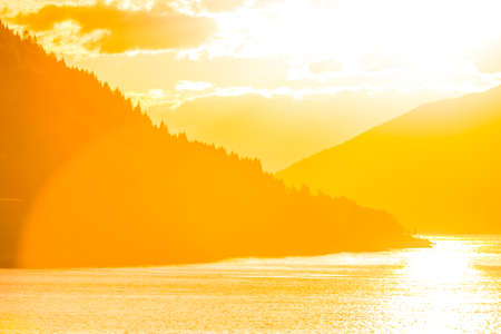 A beautiful, colorful sunset over the fjords. September landscape of Norway. Autumn scenery of Northern Europe.の写真素材