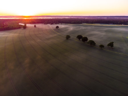 Majestic Sunrise Over a Serene Drone Landscape of Northern Europeの写真素材