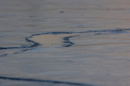 Frozen Serenity: Winter's Icy Embrace on the River in Northern Europeの写真素材