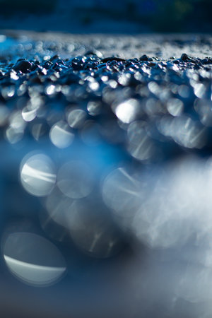 Shimmering Treasures: Serene Baltic Sea Shoreline. Shallow deapth of field picture of sandy Baltic...