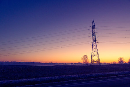 A beautiful morning scenery of an industrial construction against the sky. Early winter scenery of Northern Europe.の写真素材