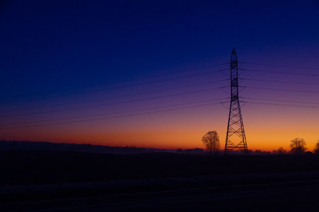 A beautiful morning scenery of an industrial construction against the sky. Early winter scenery of Northern Europe.の写真素材