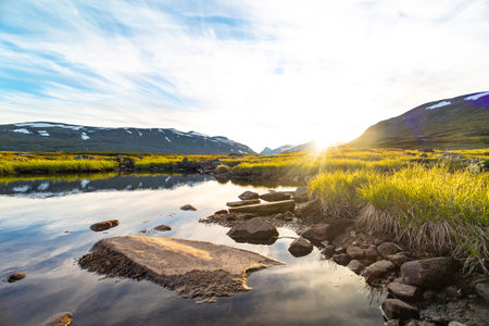A beautiful small mountain lake in Sarek National Park, Sweden during august. Summer landscape of...