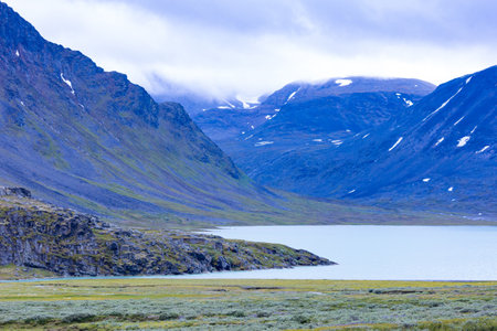 A beautiful small mountain lake in Sarek National Park, Sweden during august. Summer landscape of northern wilderness in Scandinavia.の写真素材